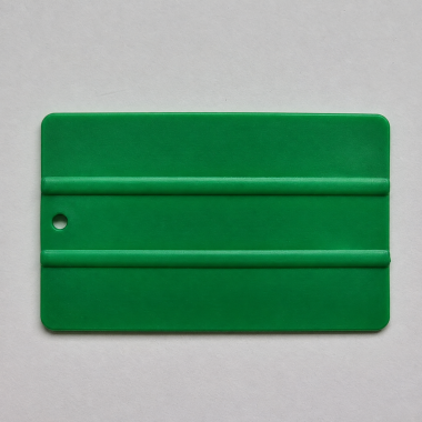 Espátula plástica lisa verde de 13x8 cm para rotulación y gráfica.
